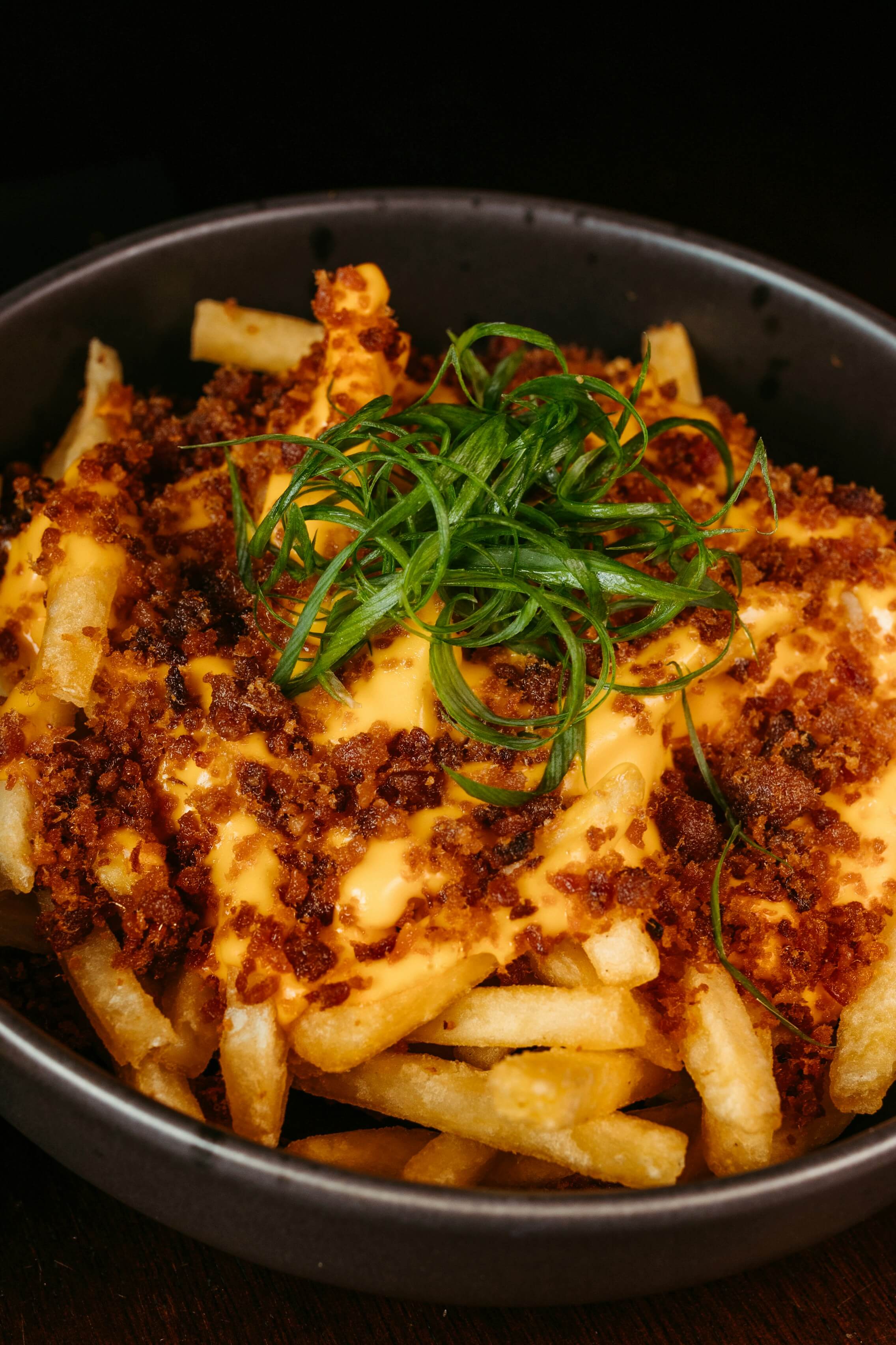 A smaller portion of chips and curry sauce