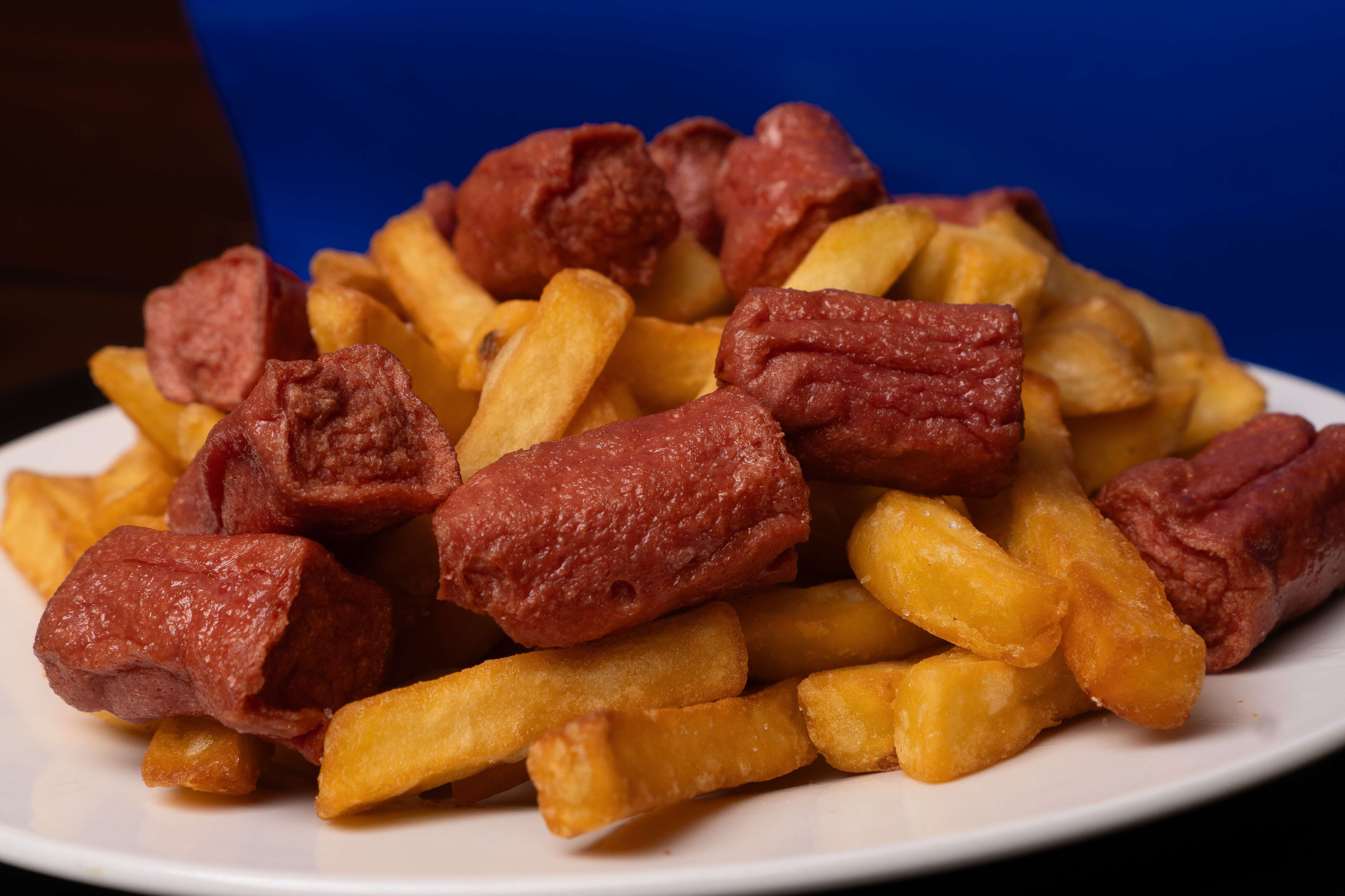 A smaller portion of chips and sausage